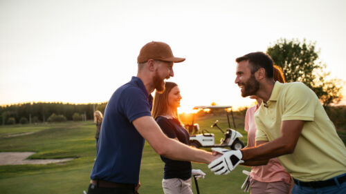 Golfing,Partners,Shaking,Hands,After,A,Game,Of,Golf